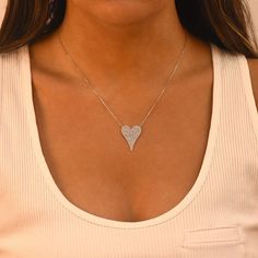 "CZ Diamond Stone Heart Shape Necklace - 14K Gold or Rhodium Plated 925 Silver - 14\" + 2 Extender 14K Gold Plated and Rhodium Plated 925 Sterling Silver Length: 14\" + 2 Extender 1 MM Cubic Zirconia Stones Ave. Weight: 3.72 grams Lead And Nickle Free Free Gift Pouch Included SAFE FOR ALL SKIN TYPES: All Our Chains are hypoallergenic and nickel free so they are safe for all skin types. If you have sensitive skin, you will love our product. 100% SATISFACTION GUARANTEE! - Our absolute 100% no-ques Heart Shape Necklace, Pave Heart Necklace, Heart Shaped Necklace, Star Chain, Heart Chain, Round Stud Earrings, Gift Pouch, Stone Heart, Cz Diamond