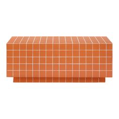 an orange tiled bench sitting on top of a white floor