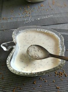 a spoon is in a bowl filled with liquid