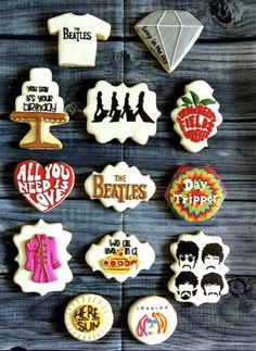 the beatles cookies are arranged on a table