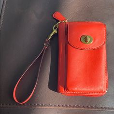 Good Condition, Never Used, Orange Wrist Wallet With Many Pockets From Coach. Coach Wallets With Cell Phone Pocket For Daily Use, Coach Leather Wallet For On-the-go, Coach Leather Coin Purse, Coach Leather Coin Purse For Everyday, Coach Wallet With Snap Closure For Everyday Use, Coach Travel Wallet Pouch, Coach Wallets With Removable Pouch For Travel, Coach Leather Wallet, Coach Wallets With Snap Closure For Daily Use