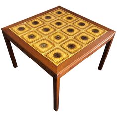 a wooden table with an intricate design on it