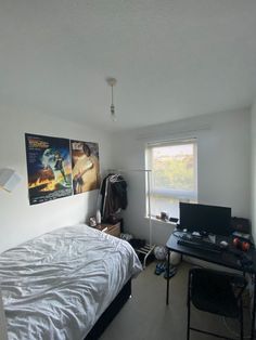 the bedroom is clean and ready to be used as a work space for someone's computer