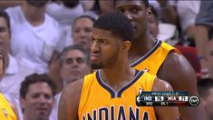 two basketball players standing next to each other