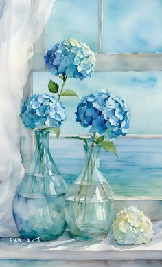 three vases filled with blue flowers sitting on a window sill