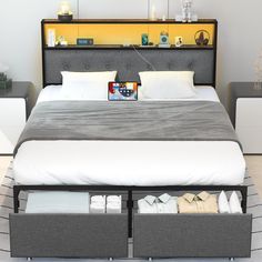 a bed with two storage drawers underneath it