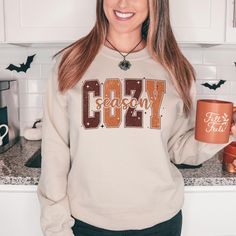 Get in the spirit of the fall season with this simple COZY SEASON graphic sweatshirt. Perfect for fall, trick or treat, or a day at the pumpkin patch. Whether you love coffee or not, you have to agree - these sweatshirts are so adorable for your fall festivities! Our shirts are great for the fall season and would make a great gift.  Are you looking for your new favorite t-shirt? Our graphic tees are custom created specifically for you and made by me not sourced out to a print shop. Select your shirt style, color, and print design. Your item will be created using direct-to-garment (DTG) print technology. Large garment printers utilize digital images to create unique and colorful designs. Water-based inks will be infused into the fabric of your t-shirt to create a smooth and soft-to-the-touc Fall Festivities, Single Shirt, Cozy Season, Sweatshirt Cute, Love Coffee, Fall Sweatshirt, Fall Festival, Cozy Sweatshirts, Cozy Fall