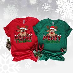 Christmas has never been so cozy! Our limited-edition Rudolf Merry Christmas Tee and Sweatshirt are perfect for spreading holiday cheer. Featuring a festive design and soft, comfy fabric your loved ones will be sure to cherish this gift for years to come! Make the holidays even more special with this timeless classic. Christmas Designs For Shirts, Holiday Gift Red T-shirt, Red Christmas Graphic Tee, Red Christmas Tops As Gift, Red Christmas Top For Gift, Red Christmas Top As Gift, Red Graphic Tee For Christmas, Red Festive T-shirt With Letter Print, Red Christmas Shirt