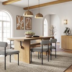 a dining room table with four chairs around it