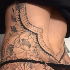 the back of a woman's lower body with flowers on it