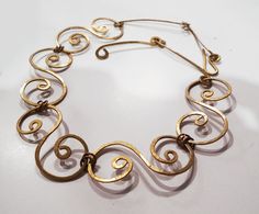 Hammered celtic brass handmade necklace Spirals, snails. There's a reason the spiral is featured heavily in many cultures. It is an icon for expansive, cosmic wisdom, which our ancestors were highly connected to. Get a more intimate experience with this concept by incorporating the spiral in various ways. MY DEAR CUSTOMERS, PLEASE NOTE, THAT THE TIME OF DELIVERY FROM LATVIA (EUROPE) TO US CAN TAKE FROM 5 TO 30 DAYS. That is why I make your orders so fast, that you can get them as soon, as it pos Handmade Vintage Spiral Jewelry, Handmade Gold Swirl Jewelry, Handmade Swirl Shaped Gold Jewelry, Gold Handmade Swirl Jewelry, Gold Swirl Handmade Jewelry, Gold Swirl-shaped Handmade Jewelry, Artistic Gold Necklace For Festival, Bohemian Gold Swirl Jewelry, Handmade Spiral Metal Necklace