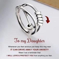 a ring with the words to my daughter on it, and an arrow pointing up