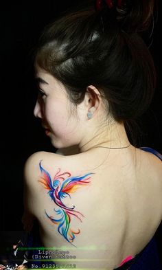 a woman with a colorful tattoo on her back