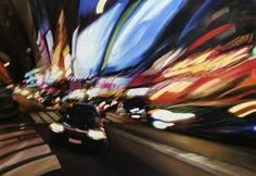 a painting of a car driving down the street in front of some buildings at night