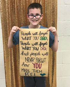 a young boy holding up a sign that says people will forget what you said