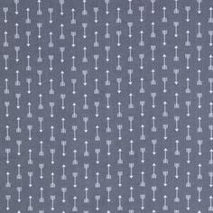 an upholstered gray and white fabric with arrows in the middle, on a dark grey background