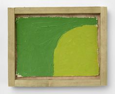 a green and yellow painting in a wooden frame