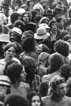 a crowd of people standing next to each other