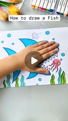 a person's hand on top of a drawing board