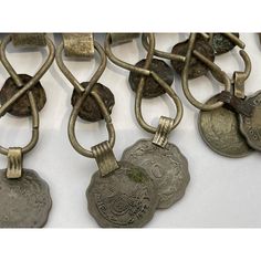 A Moroccan Tribal jewelry vintage a chocker inlaid with colorful glass beads in red and green and dangling coins. Silver, but not of the standard of sterling and richly embellished with applied silver designs and filigree.  Chocker size: 10" height x 10" wide including coins. chocker only is 8" x 8". German nickel coin silver. A Moroccan beautiful ethnic metal silvered jewelry choker.It is a traditional piece of jewelry that is worn around the neck handmade by skilled artisans in Morocco and ref Vintage Metal Coin Pendant Necklace, Traditional Coin Necklaces As Collectibles, Traditional Coin Necklaces For Collectors, Bohemian Jewelry With Coin Pendant For Collectible, Collectible Metal Jewelry With Coin Pendant, Vintage Ceremonial Jewelry With Coin Pendant, Antique Coin-shaped Metal Jewelry, Antique Coin Shaped Metal Jewelry, Traditional Bronze Coin Pendant Jewelry