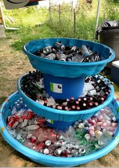 three tiered buckets filled with soda bottles