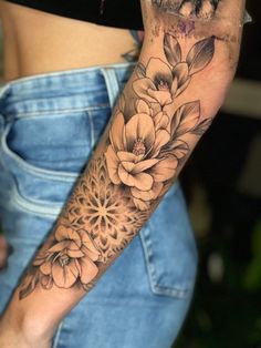 a woman with a flower tattoo on her arm