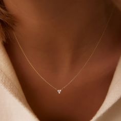 Made to Order Gold KT: 14K Solid Gold Round Diamond: 3 pcs 1.75MM Total CTW: 0.09ctw Diamond Color-Clarity: G Color Si Clarity Setting Type: Prong A thin 14k gold chain holds three stunning round cut diamonds set in a triangle. We are committed to excellence so each gold diamond jewelry piece is made to order right here in the USA. She'll love that she can wear this exquisite gold diamond trio necklace from the office to an elegant evening soiree. Three Diamond Necklace, 3 Diamond Necklace, Simple Jewelry Necklace, Grad Necklace, Modern Diamond Necklace, Unique Diamond Pendant, Gold Necklace With Diamond, Small Diamond Necklace, Diamond Necklace Simple