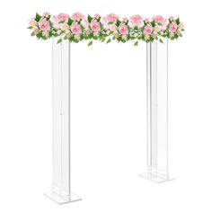 two tall clear vases with pink flowers and greenery on the top one is empty