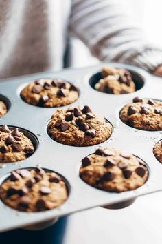 a muffin tin filled with chocolate chip cookies