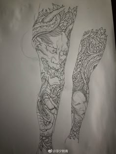 a drawing of two legs with tattoos on them