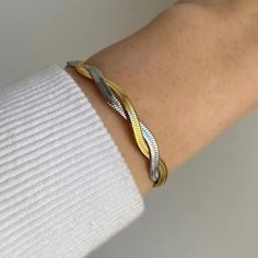 Our Eleanor Watchband Bracelet adds a trendy and timeless touch to any outfit. The perfect accessory for those looking to exude girl boss vibes. Made with high-quality materials for durability and style. Elevate your look and make a statement with this must-have piece. 316L Stainless Steel 18K PVD Gold Plated 6.5 inches long +2" inches ext/ 7mm wide Trendy Metal Bracelets Tarnish Resistant, Chic Everyday Bangle With Bracelet Strap, Trendy Metal Bracelets With Tarnish Resistance, Chic Tarnish Resistant Metal Bracelets, Trendy Gold Cuff Bracelet, Trendy Metal Bangle For Everyday, Trendy Stainless Steel Jewelry As Fashion Accessory, Trendy Adjustable Braided Bangle Bracelet, Chic Stainless Steel Jubilee Bracelet