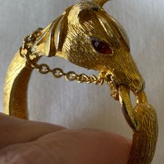 Fabulous, Vintage, And Hard To Find Horse Clamp Bracelet. The Horse Head Is Detailed And Dimensional, With Red Marquise Rhinestone Eyes And Dangling Chain Reins. The Gold Plated Metal Is Textured And In Excellent Condition. Closure Is “Bit” In Horses Mouth. The Hinge Is Tight And In Euc Inner Measurements Are 1.75” X 2", Best Fits A Small To Medium Wrist. Rare Vintage Horse, Horse Head, Red Gold, Womens Jewelry Bracelets, Equestrian, Women Jewelry, Horses, Chain, Red