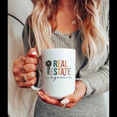 a woman holding a coffee mug with the words angry women change the world on it