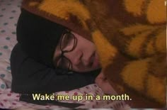 a person laying in bed under a teddy bear blanket with the caption wake me up in a month