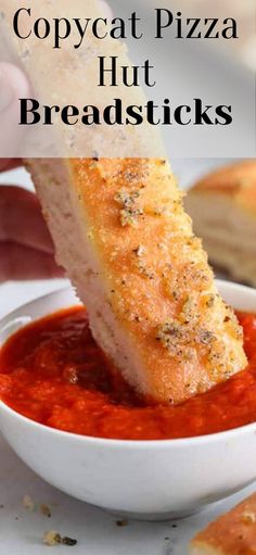 a person dipping some bread into a bowl of red sauce with the words copycat pizza hut breadsticks