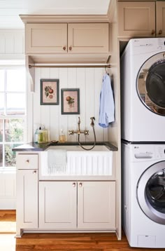 a washer and dryer sitting next to each other in a kitchen