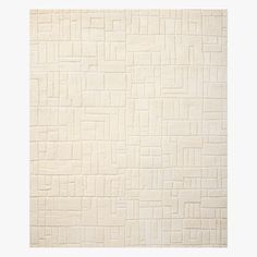 a white rug with squares and lines on it