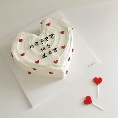 a heart shaped cake on top of a white card