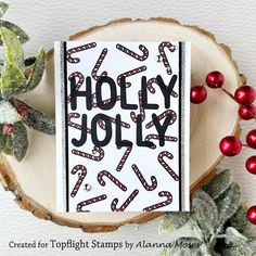 a christmas card with the words holly jolly on it and candy canes around it