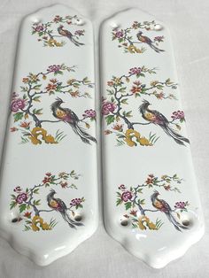 two decorative porcelain plates with birds on them