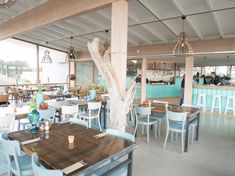 the inside of a restaurant with tables and chairs