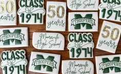 decorated cookies with green and white frosting are arranged in the shape of letters that spell out class