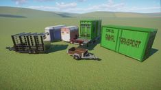 several containers and trailers in the middle of an open field