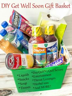 a green basket filled with lots of food and condiments on top of a wooden table