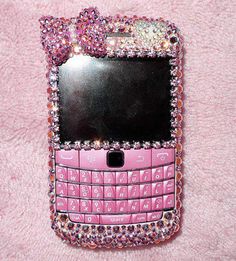 a cell phone covered in pink and silver jewels