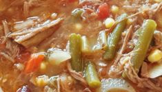 a white bowl filled with meat and vegetables