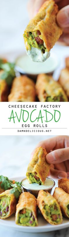 an egg roll is being held up to show the inside and outside of it with avocado on top