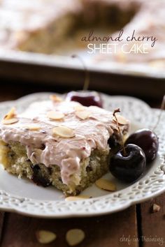 a slice of almond cherry sheet cake on a plate