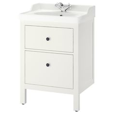 a white sink with two drawers and a faucet