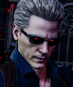 a man with grey hair and sunglasses in front of a red light on the wall